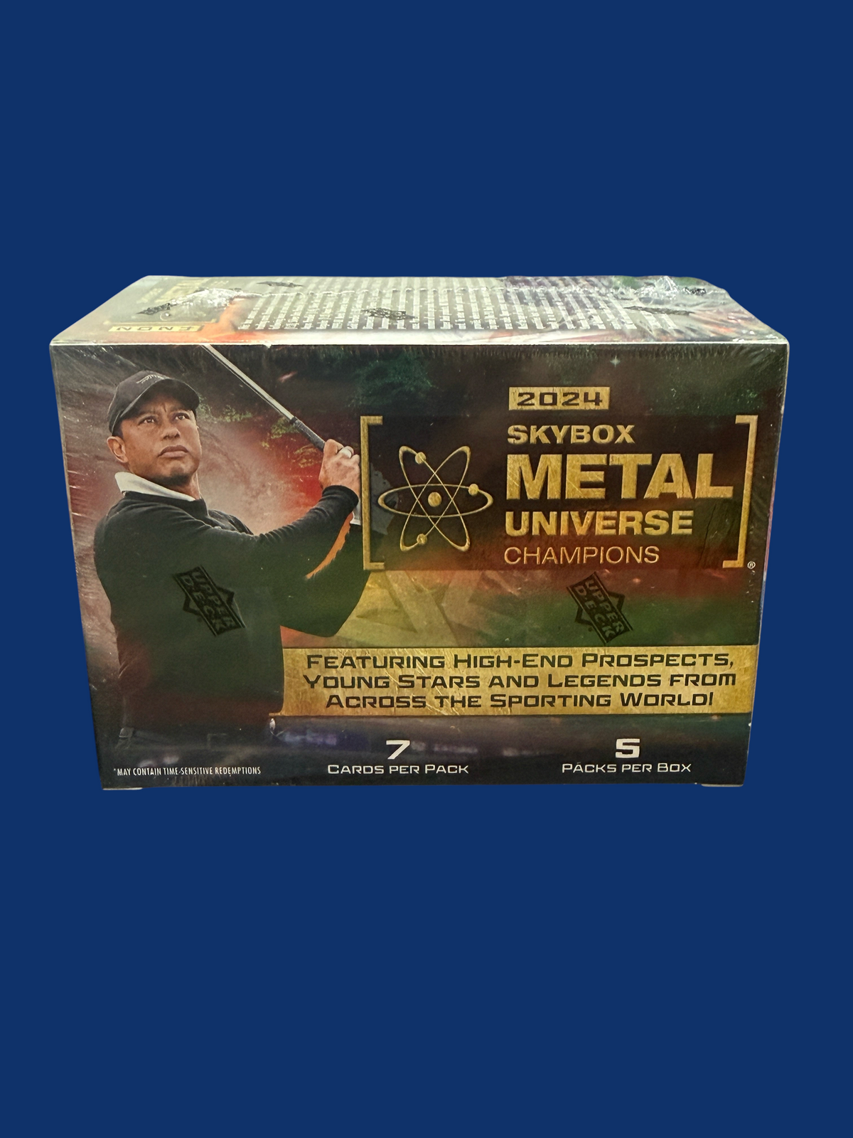 Utah Breaks 2024 Skybox Metal Universe Champions sports trading card blaster box featuring Tiger Woods on the packaging
