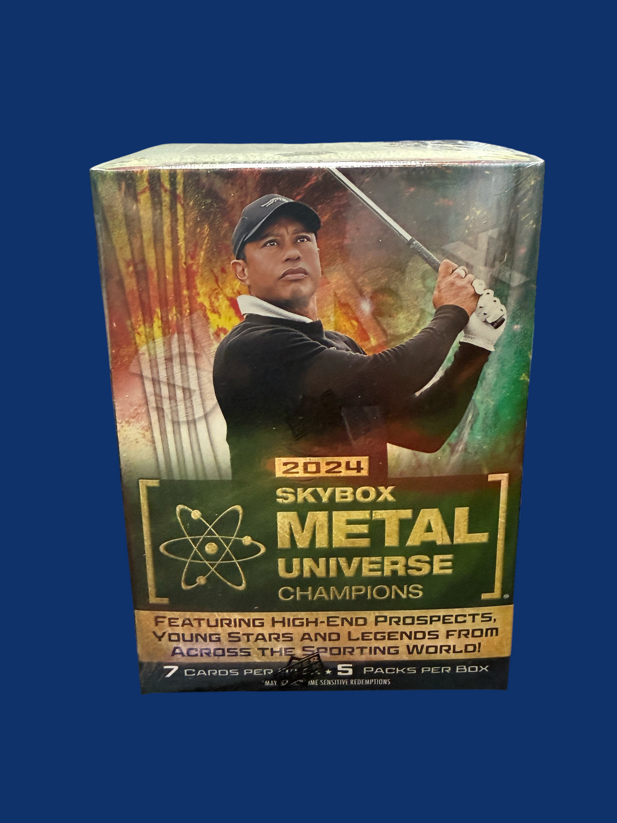 Utah Breaks 2024 Skybox Metal Universe Champions sports trading card blaster box featuring Tiger Woods on the cover
